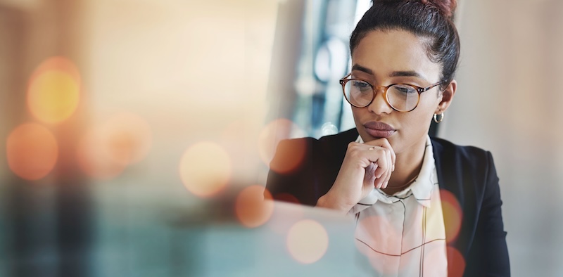 Business woman, thinking and planning on computer for Human Resources solution, recruitment website or vision. Professional HR worker or employee ideas and problem solving on laptop and banner mockup