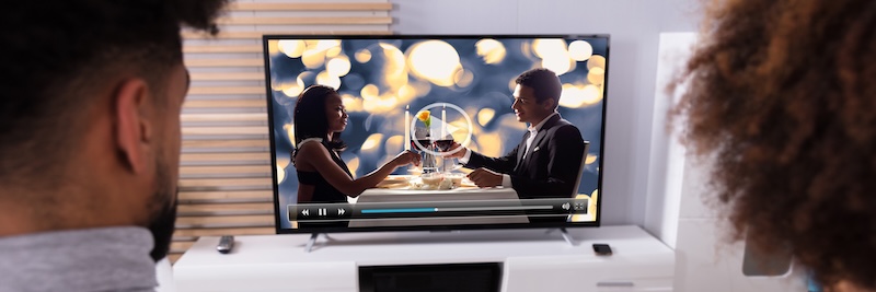 Couple Connecting Television Through WiFi On Digital Tablet